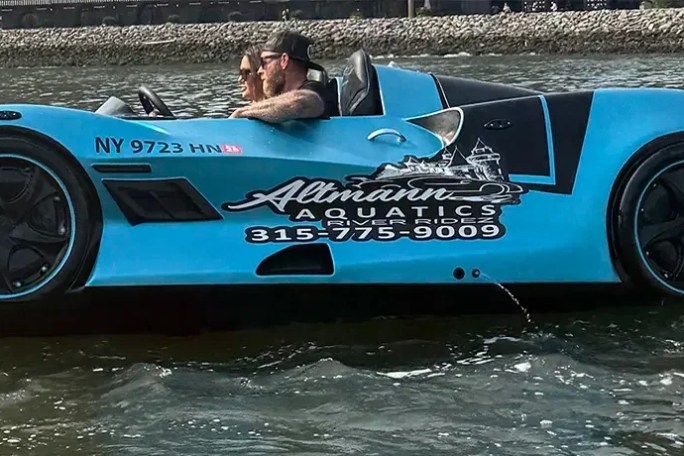 Blue jet car floating on water with person driving and text '1 Hour Jet Car Rental'.